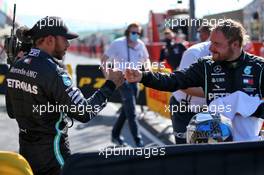 (L to R): Lewis Hamilton (GBR) Mercedes AMG F1 celebrates his pole position in qualifying parc ferme with third placed team mate Valtteri Bottas (FIN) Mercedes AMG F1. 12.09.2020. Formula 1 World Championship, Rd 9, Tuscan Grand Prix, Mugello, Italy, Qualifying Day.