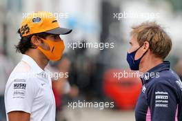 (L to R): Carlos Sainz Jr (ESP) McLaren with Xavi Martos (ESP) Racing Point F1 Team Physio. 10.09.2020. Formula 1 World Championship, Rd 9, Tuscan Grand Prix, Mugello, Italy, Preparation Day.
