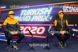 (L to R): Carlos Sainz Jr (ESP) McLaren and team mate Lando Norris (GBR) McLaren in the FIA Press Conference. 12.11.2020. Formula 1 World Championship, Rd 14, Turkish Grand Prix, Istanbul, Turkey, Preparation Day.