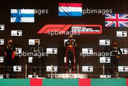 The podium (L to R): Paul Monaghan (GBR) Red Bull Racing Chief Engineer; Valtteri Bottas (FIN) Mercedes AMG F1, second; Max Verstappen (NLD) Red Bull Racing, race winner; Lewis Hamilton (GBR) Mercedes AMG F1, third.. 13.12.2020. Formula 1 World Championship, Rd 17, Abu Dhabi Grand Prix, Yas Marina Circuit, Abu Dhabi, Race Day.