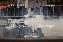 Lewis Hamilton (GBR) Mercedes AMG F1 W11 - doughnuts at the end of the race. 13.12.2020. Formula 1 World Championship, Rd 17, Abu Dhabi Grand Prix, Yas Marina Circuit, Abu Dhabi, Race Day.