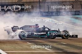 Lewis Hamilton (GBR) Mercedes AMG F1 W11 and Valtteri Bottas (FIN) Mercedes AMG F1 W11 - doughnuts at the end of the race. 13.12.2020. Formula 1 World Championship, Rd 17, Abu Dhabi Grand Prix, Yas Marina Circuit, Abu Dhabi, Race Day.