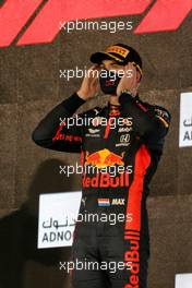 Race winner Max Verstappen (NLD) Red Bull Racing celebrates on the podium. 13.12.2020. Formula 1 World Championship, Rd 17, Abu Dhabi Grand Prix, Yas Marina Circuit, Abu Dhabi, Race Day.