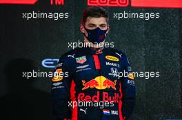 Race winner Max Verstappen (NLD) Red Bull Racing on the podium. 13.12.2020. Formula 1 World Championship, Rd 17, Abu Dhabi Grand Prix, Yas Marina Circuit, Abu Dhabi, Race Day.