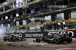 Lewis Hamilton (GBR) Mercedes AMG F1 W11 and Valtteri Bottas (FIN) Mercedes AMG F1 W11 - doughnuts at the end of the race. 13.12.2020. Formula 1 World Championship, Rd 17, Abu Dhabi Grand Prix, Yas Marina Circuit, Abu Dhabi, Race Day.
