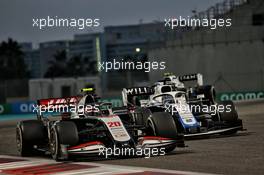 Kevin Magnussen (DEN) Haas VF-20 and Nicholas Latifi (CDN) Williams Racing FW43. 13.12.2020. Formula 1 World Championship, Rd 17, Abu Dhabi Grand Prix, Yas Marina Circuit, Abu Dhabi, Race Day.