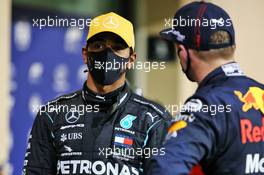 (L to R): Lewis Hamilton (GBR) Mercedes AMG F1 in qualifying parc ferme with Max Verstappen (NLD) Red Bull Racing. 12.12.2020. Formula 1 World Championship, Rd 17, Abu Dhabi Grand Prix, Yas Marina Circuit, Abu Dhabi, Qualifying Day.