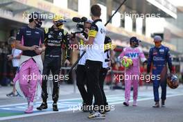 Lance Stroll (CDN) Racing Point F1 Team with Esteban Ocon (FRA) Renault F1 Team. 13.12.2020. Formula 1 World Championship, Rd 17, Abu Dhabi Grand Prix, Yas Marina Circuit, Abu Dhabi, Race Day.