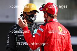 (L to R): Lewis Hamilton (GBR) Mercedes AMG F1 with Sebastian Vettel (GER) Ferrari. 13.12.2020. Formula 1 World Championship, Rd 17, Abu Dhabi Grand Prix, Yas Marina Circuit, Abu Dhabi, Race Day.