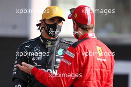 (L to R): Lewis Hamilton (GBR) Mercedes AMG F1 and Sebastian Vettel (GER) Ferrari. 13.12.2020. Formula 1 World Championship, Rd 17, Abu Dhabi Grand Prix, Yas Marina Circuit, Abu Dhabi, Race Day.