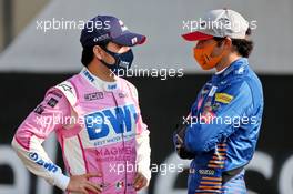 (L to R): Sergio Perez (MEX) Racing Point F1 Team with Carlos Sainz Jr (ESP) McLaren. 13.12.2020. Formula 1 World Championship, Rd 17, Abu Dhabi Grand Prix, Yas Marina Circuit, Abu Dhabi, Race Day.