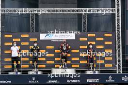 The podium (L to R): Guanyu Zhou (CHN) Uni-Virtuosi Racing, second; Nikita Mazepin (RUS) Hitech, race winner; Yuki Tsunoda (JPN) Carlin, third.                                 01.08.2020. FIA Formula 2 Championship, Rd 4, Silverstone, England, Saturday.