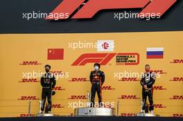 Podium: (L to R) Guanyu Zhou (CHN) Uni-Virtuosi Racing, second place; Yuki Tsunoda (JPN) Carlin, race winner; Nikita Mazepin (RUS) Hitech, third place. 05.12.2020. FIA Formula 2 Championship, Rd 12, Sakhir, Bahrain, Saturday.