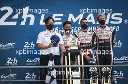 (L to R): Race winners Kazuki Nakajima (JPN), Sebastien Buemi (SUI), and Brendon Hartley (NZL) #08 Toyota Gazoo Racing, celebrate on the podium. 20.09.2020. FIA World Endurance Championship, Le Mans 24 Hours, Race, Le Mans, France. Sunday.