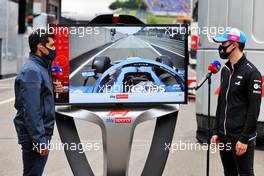 (L to R): Karun Chandhok (IND) Sky Sports F1 Presenter with Guanyu Zhou (CHN) Alpine F1 Team Test Driver. 02.07.2021. Formula 1 World Championship, Rd 9, Austrian Grand Prix, Spielberg, Austria, Practice Day.