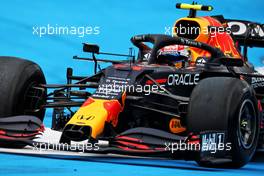 Sergio Perez (MEX) Red Bull Racing RB16B runs wide. 02.07.2021. Formula 1 World Championship, Rd 9, Austrian Grand Prix, Spielberg, Austria, Practice Day.