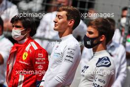 George Russell (GBR) Williams Racing as the grid observes the national anthem. 04.07.2021. Formula 1 World Championship, Rd 9, Austrian Grand Prix, Spielberg, Austria, Race Day.