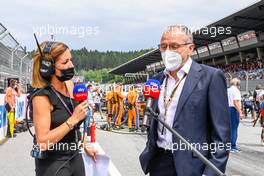 (L to R): Natalie Pinkham (GBR) Sky Sports Presenter with Stefano Domenicali (ITA) Formula One President and CEO on the grid. 04.07.2021. Formula 1 World Championship, Rd 9, Austrian Grand Prix, Spielberg, Austria, Race Day.
