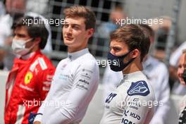 Pierre Gasly (FRA) AlphaTauri as the grid observes the national anthem. 04.07.2021. Formula 1 World Championship, Rd 9, Austrian Grand Prix, Spielberg, Austria, Race Day.