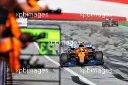 Third placed Lando Norris (GBR) McLaren MCL35M passes his team at the end of the race. 04.07.2021. Formula 1 World Championship, Rd 9, Austrian Grand Prix, Spielberg, Austria, Race Day.