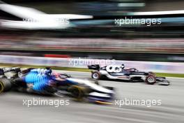 George Russell (GBR) Williams Racing FW43B and Yuki Tsunoda (JPN) AlphaTauri AT02 at the start of the race. 04.07.2021. Formula 1 World Championship, Rd 9, Austrian Grand Prix, Spielberg, Austria, Race Day.