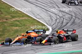 Lando Norris (GBR) McLaren MCL35M and Sergio Perez (MEX) Red Bull Racing RB16B battle for position. 04.07.2021. Formula 1 World Championship, Rd 9, Austrian Grand Prix, Spielberg, Austria, Race Day.