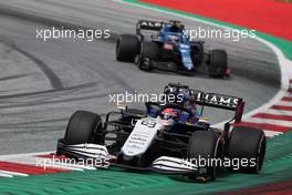 George Russell (GBR) Williams Racing FW43B leads Fernando Alonso (ESP) Alpine F1 Team A521. 04.07.2021. Formula 1 World Championship, Rd 9, Austrian Grand Prix, Spielberg, Austria, Race Day.