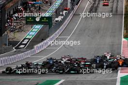 Lewis Hamilton (GBR) Mercedes AMG F1 W12 and Valtteri Bottas (FIN) Mercedes AMG F1 W12 at the start of the race. 04.07.2021. Formula 1 World Championship, Rd 9, Austrian Grand Prix, Spielberg, Austria, Race Day.