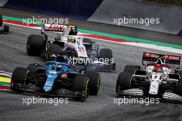 Fernando Alonso (ESP) Alpine F1 Team A521 and Kimi Raikkonen (FIN) Alfa Romeo Racing C41 battle for position. 04.07.2021. Formula 1 World Championship, Rd 9, Austrian Grand Prix, Spielberg, Austria, Race Day.