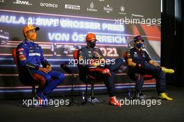 (L to R): Lando Norris (GBR) McLaren; Max Verstappen (NLD) Red Bull Racing; and Sergio Perez (MEX) Red Bull Racing, in the post qualifying FIA Press Conference. 03.07.2021. Formula 1 World Championship, Rd 9, Austrian Grand Prix, Spielberg, Austria, Qualifying Day.