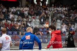 (L to R): Nikita Mazepin (RUS) Haas F1 Team and Charles Leclerc (MON) Ferrari on the drivers parade. 04.07.2021. Formula 1 World Championship, Rd 9, Austrian Grand Prix, Spielberg, Austria, Race Day.