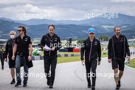 Fernando Alonso (ESP) Alpine F1 Team and Guanyu Zhou (CHN) Alpine F1 Team Test Driver walk the circuit with the team. 01.07.2021. Formula 1 World Championship, Rd 9, Austrian Grand Prix, Spielberg, Austria, Preparation Day.