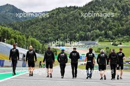 Fernando Alonso (ESP) Alpine F1 Team and Guanyu Zhou (CHN) Alpine F1 Team Test Driver walk the circuit with the team. 01.07.2021. Formula 1 World Championship, Rd 9, Austrian Grand Prix, Spielberg, Austria, Preparation Day.
