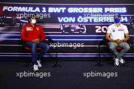 (L to R): Carlos Sainz Jr (ESP) Ferrari and Mick Schumacher (GER) Haas F1 Team in the FIA Press Conference. 01.07.2021. Formula 1 World Championship, Rd 9, Austrian Grand Prix, Spielberg, Austria, Preparation Day.
