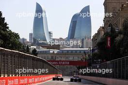 (L to R): Sergio Perez (MEX) Red Bull Racing RB16B and Fernando Alonso (ESP) Alpine F1 Team A521. 04.06.2021. Formula 1 World Championship, Rd 6, Azerbaijan Grand Prix, Baku Street Circuit, Azerbaijan, Practice Day.
