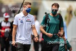 (L to R): Mick Schumacher (GER) Haas F1 Team with Sebastian Vettel (GER) Aston Martin F1 Team. 04.06.2021. Formula 1 World Championship, Rd 6, Azerbaijan Grand Prix, Baku Street Circuit, Azerbaijan, Practice Day.