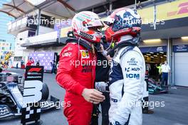 (L to R): Charles Leclerc (MON) Ferrari congratulates Pierre Gasly (FRA) AlphaTauri on his third place in parc ferme. 06.06.2021. Formula 1 World Championship, Rd 6, Azerbaijan Grand Prix, Baku Street Circuit, Azerbaijan, Race Day.