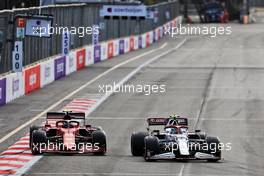 Carlos Sainz Jr (ESP) Ferrari SF-21 and Antonio Giovinazzi (ITA) Alfa Romeo Racing C41 battle for position. 06.06.2021. Formula 1 World Championship, Rd 6, Azerbaijan Grand Prix, Baku Street Circuit, Azerbaijan, Race Day.