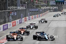 (L to R): Lando Norris (GBR) McLaren MCL35M and Esteban Ocon (FRA) Alpine F1 Team A521 battle for position. 06.06.2021. Formula 1 World Championship, Rd 6, Azerbaijan Grand Prix, Baku Street Circuit, Azerbaijan, Race Day.