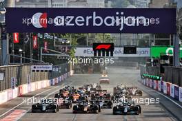 (L to R): Sebastian Vettel (GER) Aston Martin F1 Team AMR21; Sergio Perez (MEX) Red Bull Racing RB16B; and Lewis Hamilton (GBR) Mercedes AMG F1 W12 at the restart of the race. 06.06.2021. Formula 1 World Championship, Rd 6, Azerbaijan Grand Prix, Baku Street Circuit, Azerbaijan, Race Day.