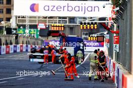 Marshals clear the debris after Max Verstappen (NLD) Red Bull Racing RB16B crashed out of the race. 06.06.2021. Formula 1 World Championship, Rd 6, Azerbaijan Grand Prix, Baku Street Circuit, Azerbaijan, Race Day.