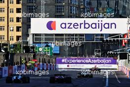 Sergio Perez (MEX) Red Bull Racing RB16B leads Sebastian Vettel (GER) Aston Martin F1 Team AMR21. 06.06.2021. Formula 1 World Championship, Rd 6, Azerbaijan Grand Prix, Baku Street Circuit, Azerbaijan, Race Day.