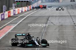 Lewis Hamilton (GBR) Mercedes AMG F1 W12 with Max Verstappen (NLD) Red Bull Racing RB16B crashed out in the background. 06.06.2021. Formula 1 World Championship, Rd 6, Azerbaijan Grand Prix, Baku Street Circuit, Azerbaijan, Race Day.