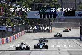 Yuki Tsunoda (JPN) AlphaTauri AT02 and Fernando Alonso (ESP) Alpine F1 Team A521 battle for position. 06.06.2021. Formula 1 World Championship, Rd 6, Azerbaijan Grand Prix, Baku Street Circuit, Azerbaijan, Race Day.