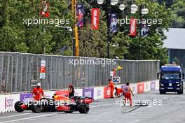 Marshals clear the track after Max Verstappen (NLD) Red Bull Racing RB16B crashed out of the race. 06.06.2021. Formula 1 World Championship, Rd 6, Azerbaijan Grand Prix, Baku Street Circuit, Azerbaijan, Race Day.