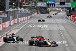 Sergio Perez (MEX) Red Bull Racing RB16B leads Lewis Hamilton (GBR) Mercedes AMG F1 W12. 06.06.2021. Formula 1 World Championship, Rd 6, Azerbaijan Grand Prix, Baku Street Circuit, Azerbaijan, Race Day.