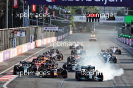 Lewis Hamilton (GBR) Mercedes AMG F1 W12 locks up under braking at the restart of the race while attempting to pass Sergio Perez (MEX) Red Bull Racing RB16B. 06.06.2021. Formula 1 World Championship, Rd 6, Azerbaijan Grand Prix, Baku Street Circuit, Azerbaijan, Race Day.