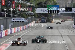 Sergio Perez (MEX) Red Bull Racing RB16B and Lewis Hamilton (GBR) Mercedes AMG F1 W12 battle for position. 06.06.2021. Formula 1 World Championship, Rd 6, Azerbaijan Grand Prix, Baku Street Circuit, Azerbaijan, Race Day.