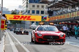 Sergio Perez (MEX) Red Bull Racing RB16B comes into the pits behind the Mercedes FIA Safety Car while the race is stopped. 06.06.2021. Formula 1 World Championship, Rd 6, Azerbaijan Grand Prix, Baku Street Circuit, Azerbaijan, Race Day.