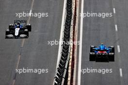 Nicholas Latifi (CDN) Williams Racing FW43B and Esteban Ocon (FRA) Alpine F1 Team A521. 05.06.2021. Formula 1 World Championship, Rd 6, Azerbaijan Grand Prix, Baku Street Circuit, Azerbaijan, Qualifying Day.